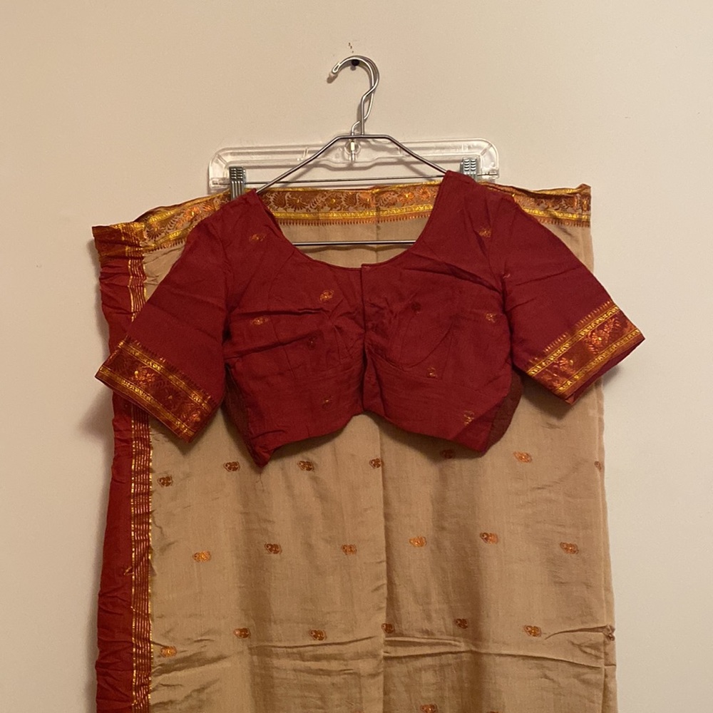 Beautiful 2 color amber/cream color saree with golden border design